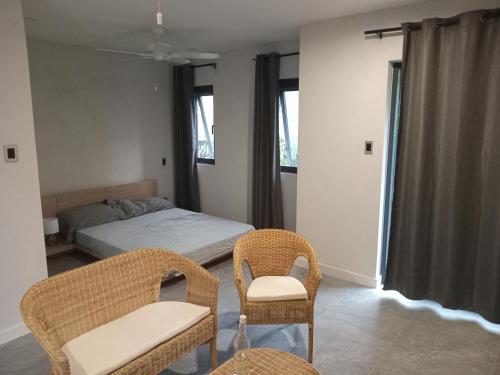 Ένα ή περισσότερα κρεβάτια σε δωμάτιο στο Sanctuary Villa