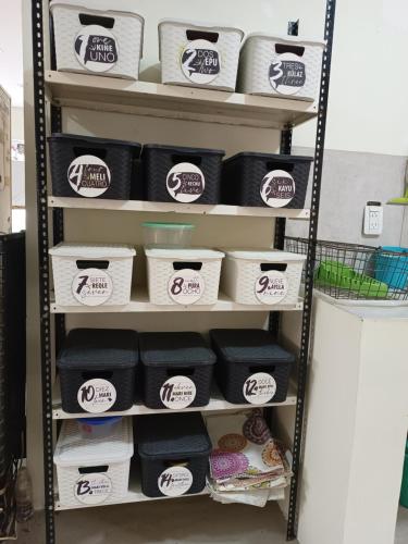 a shelf filled with lots of rolls of toilet paper at Ruca Kiñe Hostel in Las Grutas