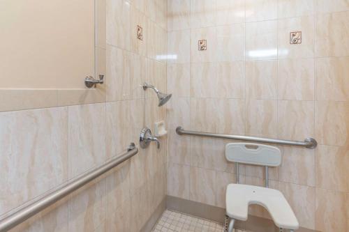 a bathroom with a shower and a toilet at Best Western Plus Airport Plaza in San Jose