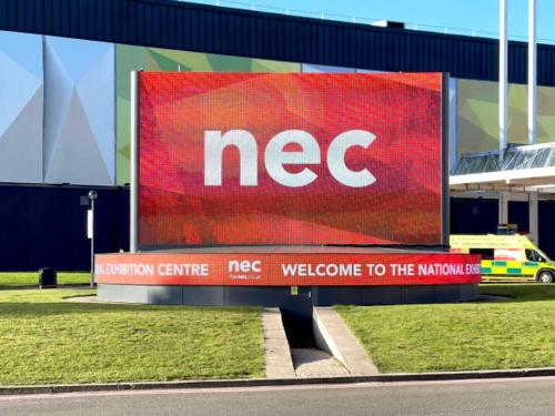 a sign that says nec on the side of a building at Johal Accommodation Ltd- NEC 1 bedroom studio apartment with free parking in Sheldon