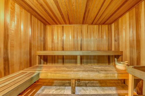 a sauna with a bench and a wooden wall at Tidewater Beach Resort in Panama City Beach