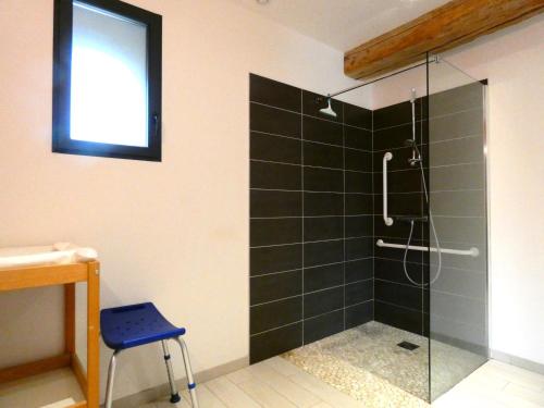 a bathroom with a shower with a glass door at Gîte Moutiers, 9 pièces, 15 personnes - FR-1-581-125 