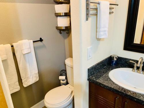 a bathroom with a toilet and a sink at The Chadwick in San Diego