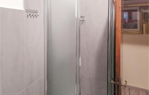 a shower with a glass door in a bathroom at Lovely Apartment In Luco Dei Marsi With Kitchen in Luco neʼ Marsi