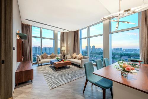 a living room with a view of a city at Sha Zhi Ye Serviced Apartment Hotel - Houjie Wanda Plaza Liaoxia Subway Station in Dongguan