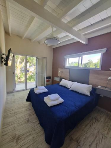 En eller flere senge i et værelse på Cabañas Mi Lugar