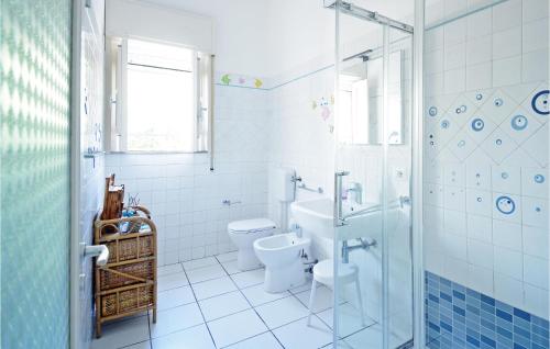 a bathroom with a toilet and a sink and a shower at Nice Home In Cava D'aliga With Wifi in Cava dʼAliga