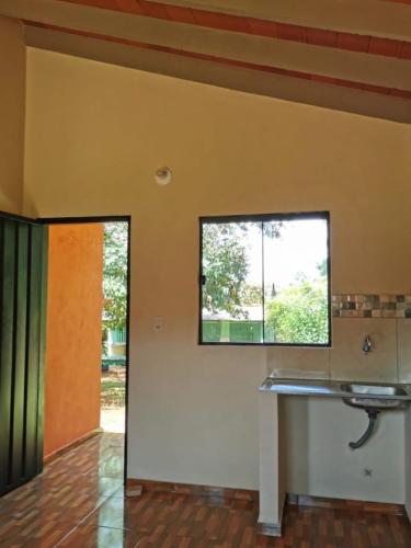 a bathroom with a sink and a window at Tranquillity in San Antonio