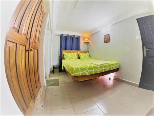Postel nebo postele na pokoji v ubytování The Yafé Bastos 10