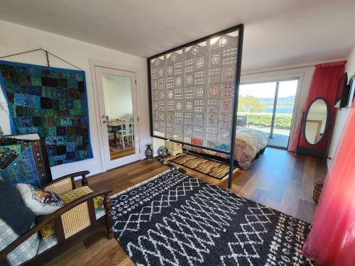 a living room with a large screen in the middle at Waterfront Abode - 2 bedrooms in Hobart