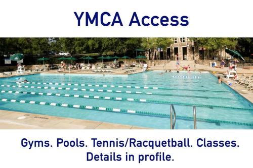 a large swimming pool with people in it at Downtown home! Walk to Bulls Stadium, DPAC & food in Durham
