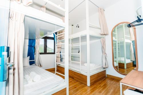a room with a mirror and a bed at MONTANA HOMESTAY VUNG TAU in Vung Tau