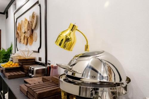 a kitchen with a toaster on a counter at Cozy An Boutique Hotel Luangprabang in Luang Prabang