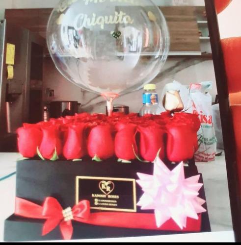 a cake with a balloon on top of it at Duran casa con piscina un solo ambiente in Guayaquil