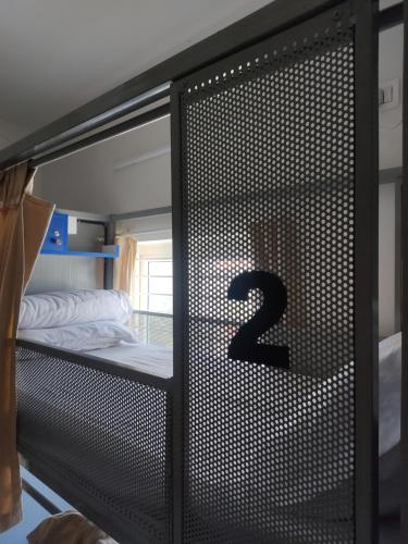 a bunk bed with the number on the door at Zylo Indiranagar in Bangalore