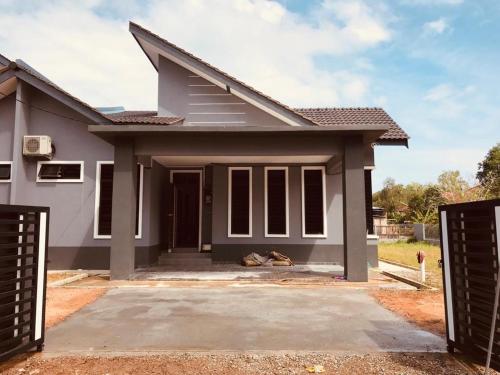 a rendering of a house with a driveway at Homestay Kaklong in Kuala Terengganu
