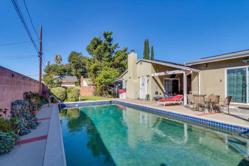 a swimming pool in front of a house at Luxury Oasis Home w/Pool Near CSUN-6 Guests in North Hills