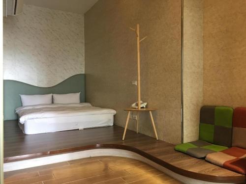 Ein Bett oder Betten in einem Zimmer der Unterkunft Now and Then Hot Spring Inn