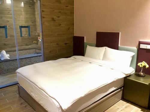 Ein Bett oder Betten in einem Zimmer der Unterkunft Now and Then Hot Spring Inn