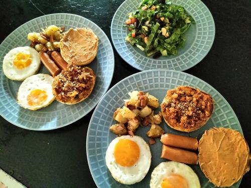 three plates of breakfast food on a table at Taakradan Valley Resort ท่ากระดานวัลเล่ย์ รีสอร์ท in Si Sawat