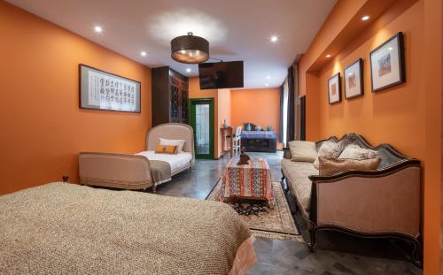 a living room with two beds and a couch at Hotel Cote Cour Deductive Beijing - Quadrangle close to Tiananmen Square & Forbidden City & Nanluoguxiang, Walk to Wangfujing, English speaking, Free WiFi, Free Laundry, Free Wonton & Noodles with Tour ticket service, Free selfies with ancient costume in Beijing