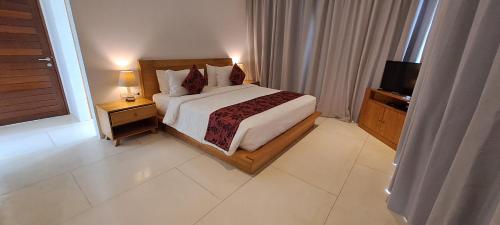 Tempat tidur dalam kamar di Nesara Villa