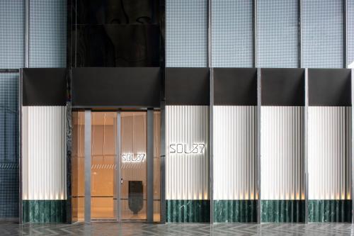 a building with a door in front of it at W Suzhou - Jinji Lake in Suzhou