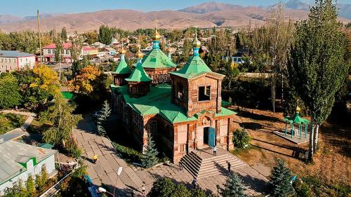 an aerial view of a church with a green roof at Кереге-Таш in Karakol