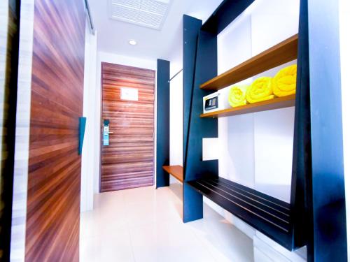 Ένα ή περισσότερα κρεβάτια σε δωμάτιο στο Phoenix Grand Patong