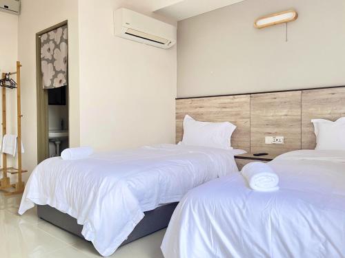Una cama o camas en una habitación de Vilana Hotel
