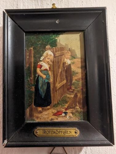 a painting of a woman standing next to a fence at FP Muehlmann&Schoen in Innervillgraten
