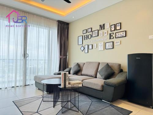 a living room with a couch and a table at JBR LUXURY HOMESTAY-ATLANTIS RESIDENCES-Near Jonker Walk-City Area-Netflix in Melaka