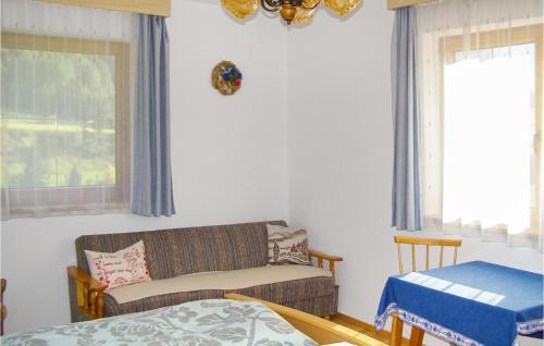 a living room with a couch and a bed at Awesome Apartment In Trins With 1 Bedrooms And Wifi in Trins