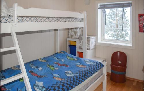 a bedroom with two bunk beds and a window at Nice Home In Drangedal With Wifi in Drangedal