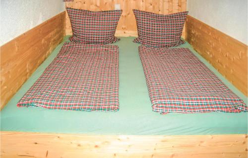 two beds with pillows on top of each other at Stunning Home In Boden With Kitchen in Boden