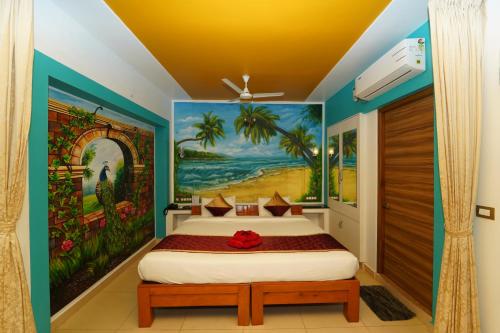 本地治里的住宿－Pearl bell Villa，一间卧室配有一张壁画床