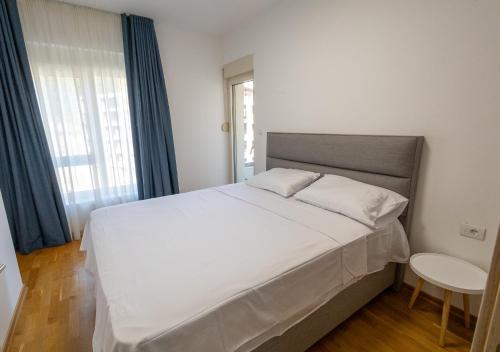 En eller flere senge i et værelse på Status-M apartments154