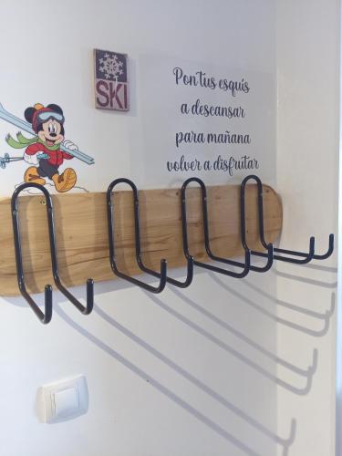 a sign on the wall of a room with a sword at ERASE OTRA VEZ en sierra nevada in Sierra Nevada