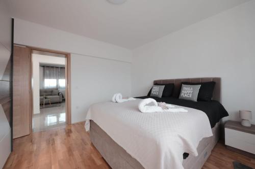 Postel nebo postele na pokoji v ubytování Apartmani Vinea Lana