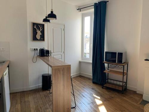 Et tv og/eller underholdning på Studio Cosy à 12 min à pieds de la Gare