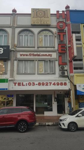 a building with cars parked in front of it at 101 Hotel Bangi in Bangi