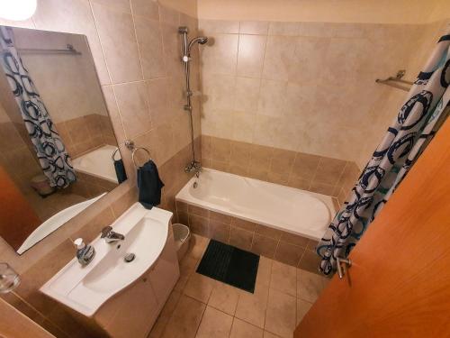 a bathroom with a sink and a tub and a toilet at 3 bed, Kapparis, Thea - 3C in Paralimni