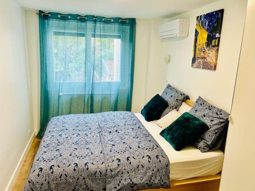 a bedroom with a bed and a window at An Exceptional Apartment, 20 Min Paris, 10 Min Orly Airport, 30 Min Disney, 25 Min Versailles, Parking free in Antony
