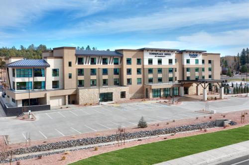 an empty parking lot in front of a building at Fairfield by Marriott Inn & Suites Show Low in Show Low