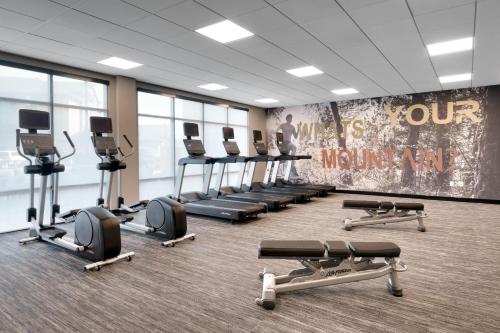 a gym with rows of exercise equipment in a room at Fairfield by Marriott Inn & Suites Show Low in Show Low