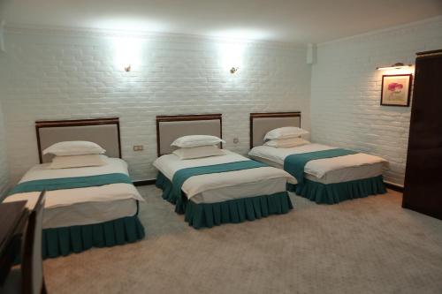 Tempat tidur dalam kamar di Za'faron Hotel