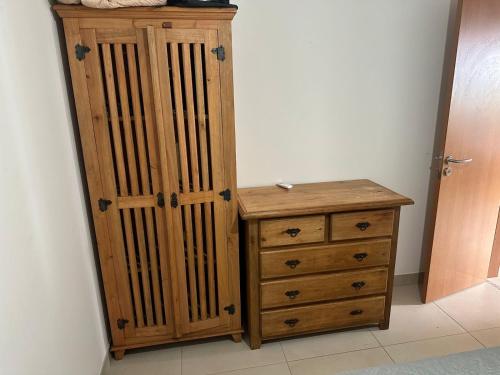 a wooden cabinet and a dresser in a room at OAHU in Mata de Sao Joao