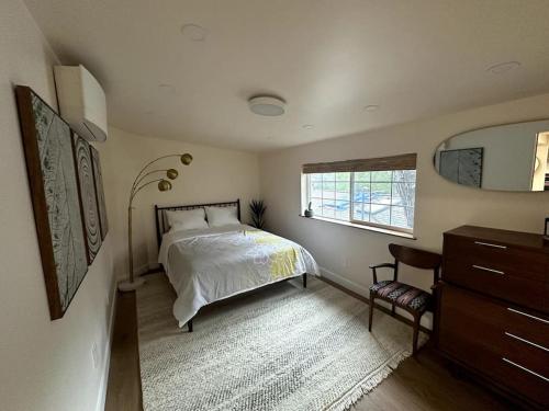 a bedroom with a bed and a window and a dresser at Tranquil retreat in Los Gatos in Los Gatos