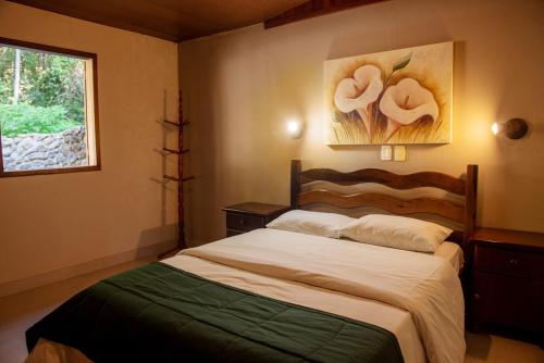 Ένα ή περισσότερα κρεβάτια σε δωμάτιο στο Hotel Vila Verde