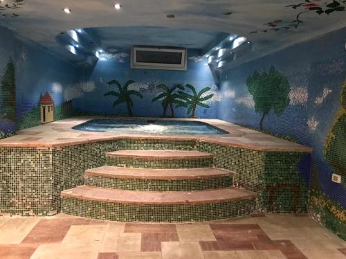 Fotografija v galeriji nastanitve Cheerful standalone villa with pool and waterfall v Kairu